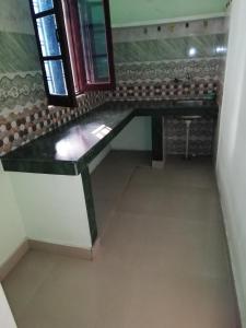 a bathroom with a sink and a mirror at Madhuvan Home stay in Rishīkesh