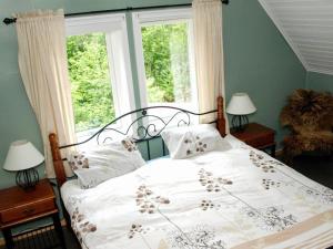 Giường trong phòng chung tại Holiday home LONEVÅG II