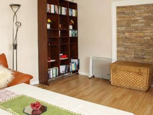 a living room with a book shelf filled with books at 6 person holiday home in LONEVÅG-By Traum in Lonevåg