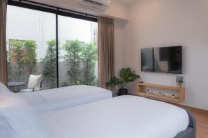 A bed or beds in a room at Eleven Pillar Site Chiangmai