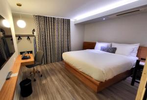 Postel nebo postele na pokoji v ubytování Hotel Keen