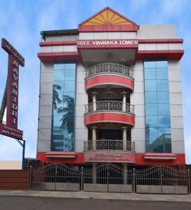 a building with a sign in front of it at Navanidhi Comforts in Bangalore