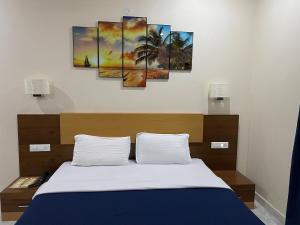Hotel Agni 객실 침대