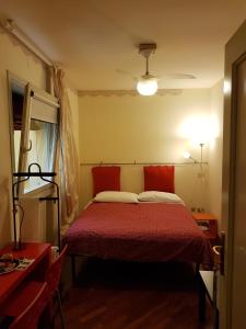 Un pat sau paturi într-o cameră la B&B Via del Carro
