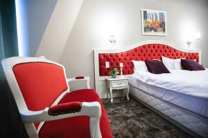 Postel nebo postele na pokoji v ubytování Grand Hotel Traian