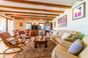 a living room with a couch and a table at Ideal Property Mallorca - Axilo - Els Mitjans in Artá