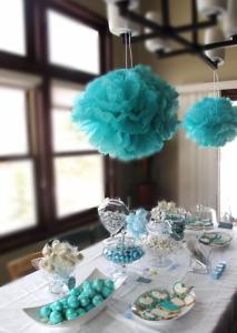 a table with blue decorations and plates of food at Casa Adelina in Băile Herculane