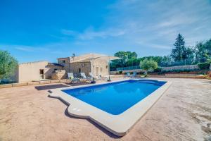 a large swimming pool in a yard with a house at Ideal Property Mallorca - Brivo in Sencelles