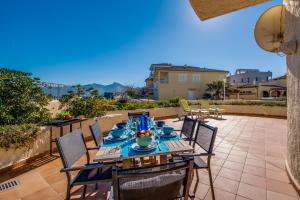 a table and chairs on a patio at Ideal Property Mallorca - Ca sa Tati in Son Serra de Marina