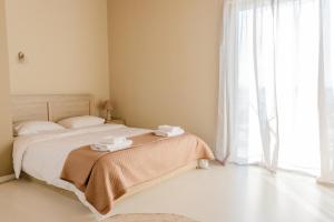 Postel nebo postele na pokoji v ubytování Island Apartments
