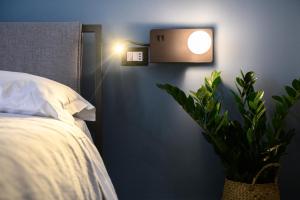 A bed or beds in a room at Alma Suites