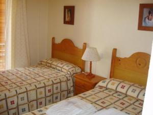 Postel nebo postele na pokoji v ubytování Apartamentos Pueblo Salado