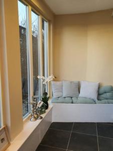 a couch sitting in a room with a window at Villa Meschede in Meschede