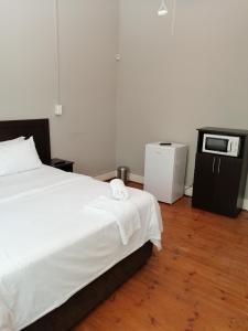 Posteľ alebo postele v izbe v ubytovaní eMvuleni Bush Lodge