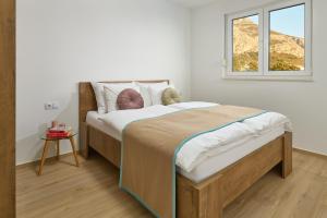 Postel nebo postele na pokoji v ubytování Sun Spalato Residence