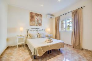 מיטה או מיטות בחדר ב-Ideal Property Mallorca - Can Olivo