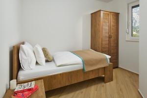 Postel nebo postele na pokoji v ubytování Sun Spalato Residence