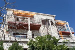 a building with scaffolding on the side of it at Apartments Neve in Dubrovnik