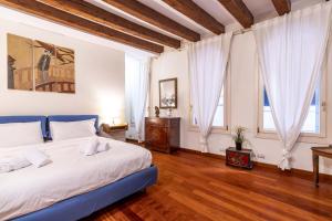 Posteľ alebo postele v izbe v ubytovaní Ca' Meraviglia