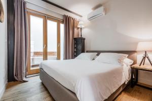 Posteľ alebo postele v izbe v ubytovaní Ferrini Home - Piazza Trento