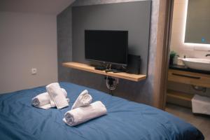 Cama o camas de una habitación en Manoir Apartments City Center