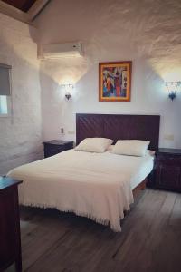 Postel nebo postele na pokoji v ubytování Hacienda Sajorami