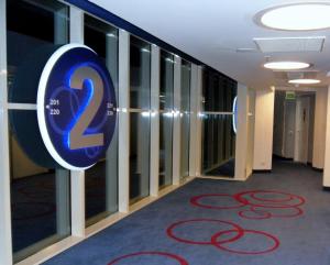 a hallway with a sign on the wall at Idea Hotel Milano Malpensa Airport in Case Nuove