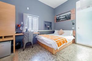 Tainan Weshare Hotel客房内的一张或多张床位