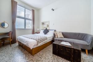 Tainan Weshare Hotel客房内的一张或多张床位