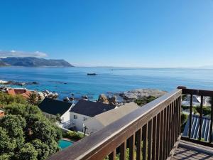 a view of the ocean from the balcony of a house at Boulders Beach House in Simonʼs Town