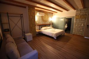 A bed or beds in a room at Oceanic Overview Suites