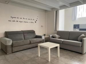 a living room with a couch and a table at la via lattea in La Spezia