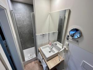 Koupelna v ubytování Hotel in der Mühle + 36 fotografií