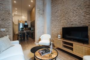 Televízia a/alebo spoločenská miestnosť v ubytovaní La Sillería de Triana by Magno Apartments
