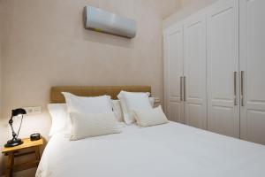 Posteľ alebo postele v izbe v ubytovaní La Sillería de Triana by Magno Apartments