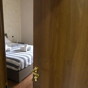 an open door to a bedroom with a bed at Portuense Sweet Home in Rome