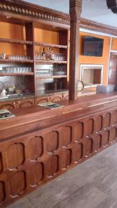 a kitchen with a wooden counter with a counter top at Стаи за гости Дончо Войвода in Koprivshtitsa