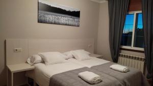Uma cama ou camas num quarto em Casa Seoane