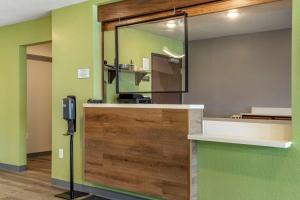 a reception desk with a sliding door in a room at WoodSpring Suites Austin Georgetown in Georgetown +37 photos