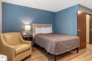 เตียงในห้องที่ WoodSpring Suites Austin Georgetown