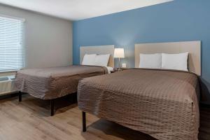 Postel nebo postele na pokoji v ubytování WoodSpring Suites Austin Georgetown