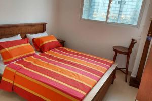 Voodi või voodid majutusasutuse Jays Apartment - Colombo 02 at the heart of convenience toas