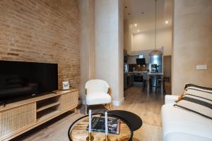 Televízia a/alebo spoločenská miestnosť v ubytovaní La Sillería de Triana by Magno Apartments