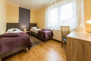 Postel nebo postele na pokoji v ubytování Apartamenty Izerskie