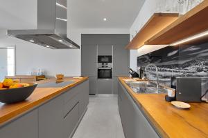 a kitchen with a bowl of fruit on a counter at Motovun Villas in Motovun +179 photos
