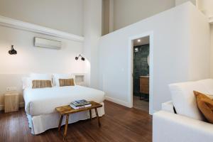 Posteľ alebo postele v izbe v ubytovaní La Sillería de Triana by Magno Apartments