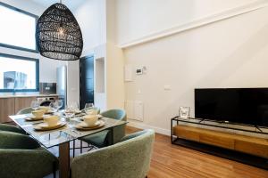 Televízia a/alebo spoločenská miestnosť v ubytovaní La Sillería de Triana by Magno Apartments