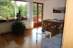 a living room with a couch and a table at Ferienwohnung Katja in Wilnsdorf