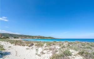 a view of a beach with blue water at Trilo 6 in Budoni