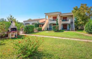 a large house with a yard in front of it at Trilo 6 in Budoni +8 photos